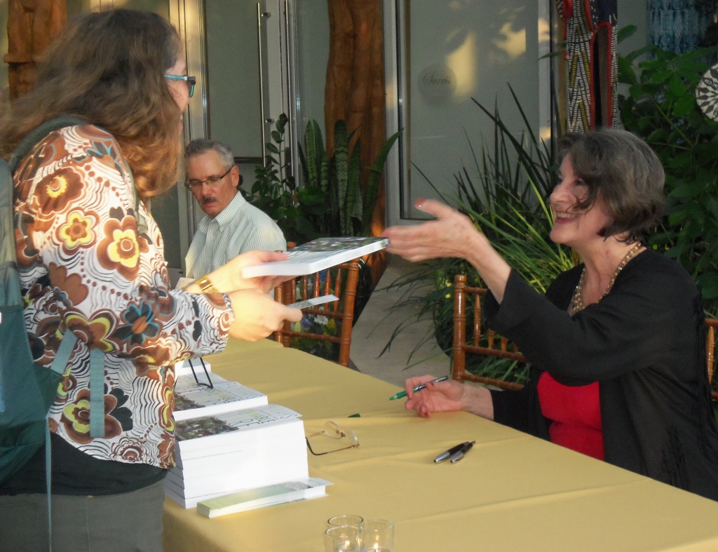 Patty DeMarco signing her new book.